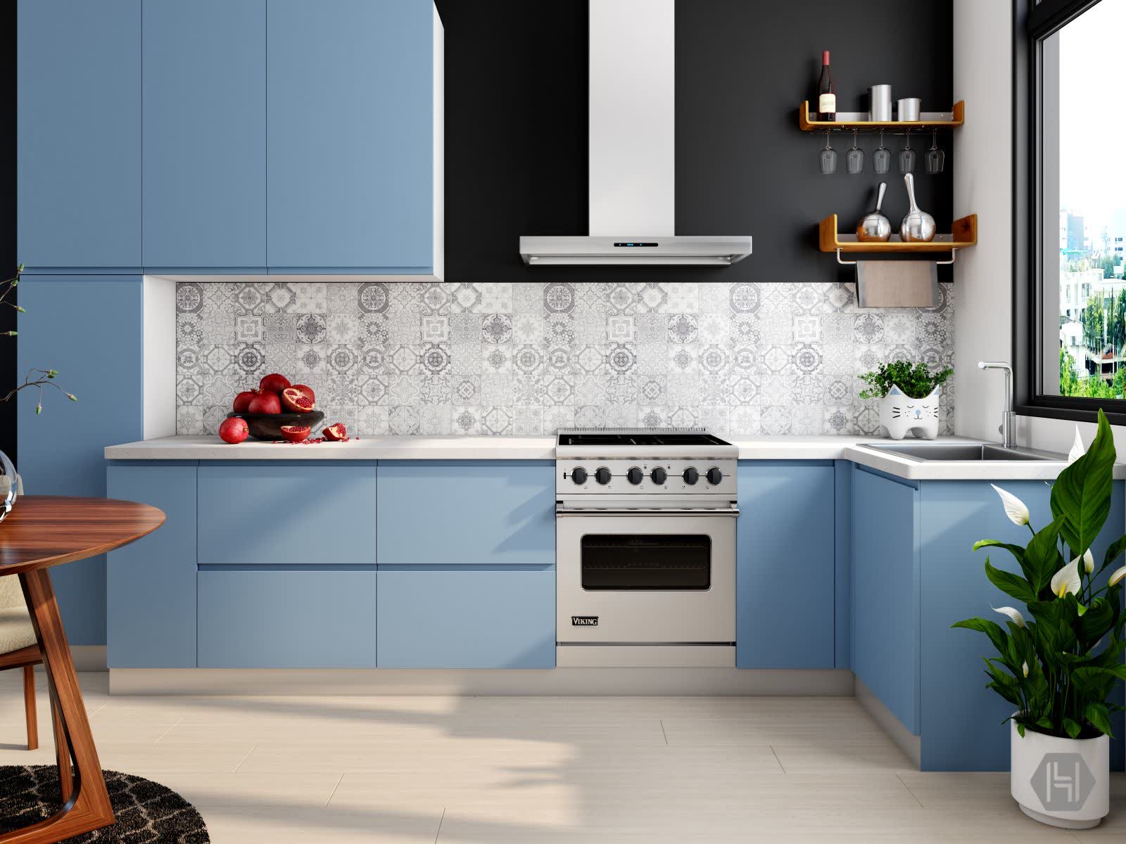 A finished kitchen remodel with pale blue cabinetry, a stainless range and a patterned tile backsplash